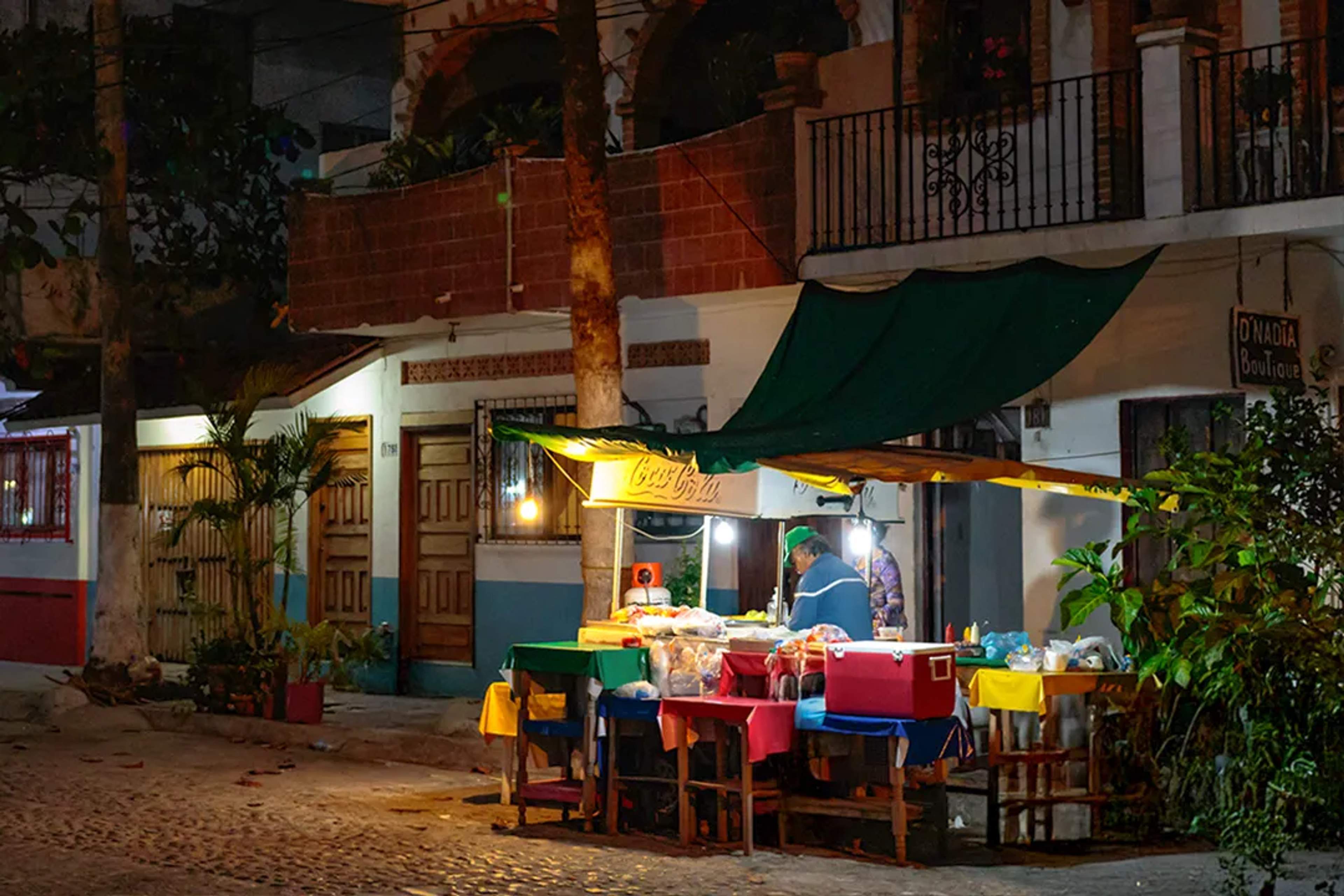 Authentic street taco stand at night in Puerto Vallarta showcasing local Mexican food culture