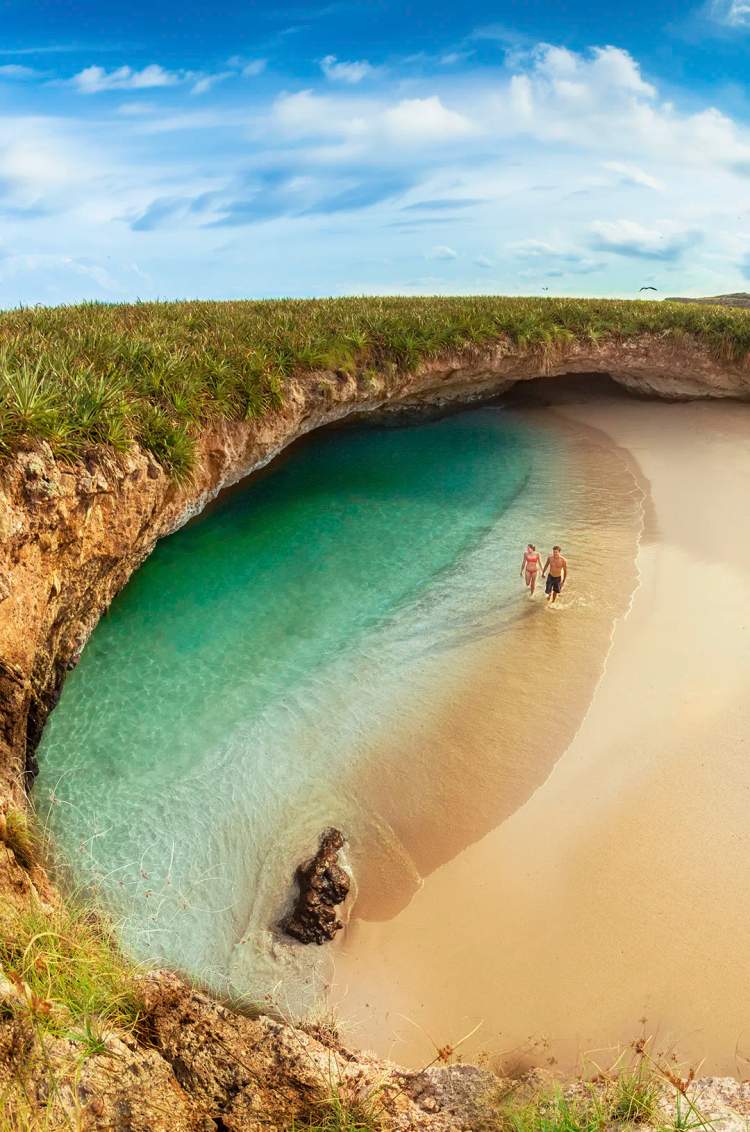 Couple exploring the famous Hidden Beach in the Marietas Islands on a private Punta Mita boat tour.