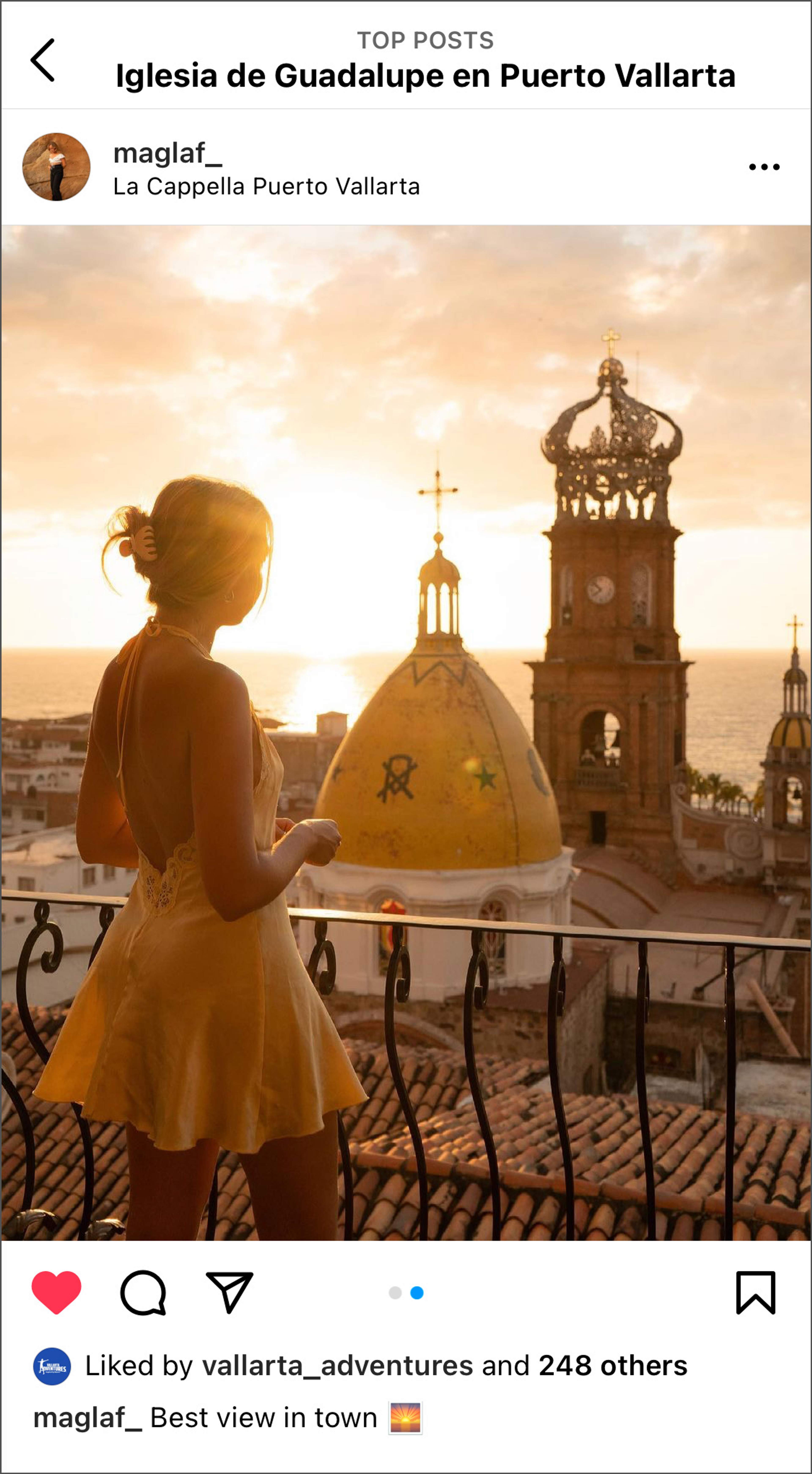 Woman admiring sunset view of Church of Our Lady of Guadalupe in Puerto Vallarta.