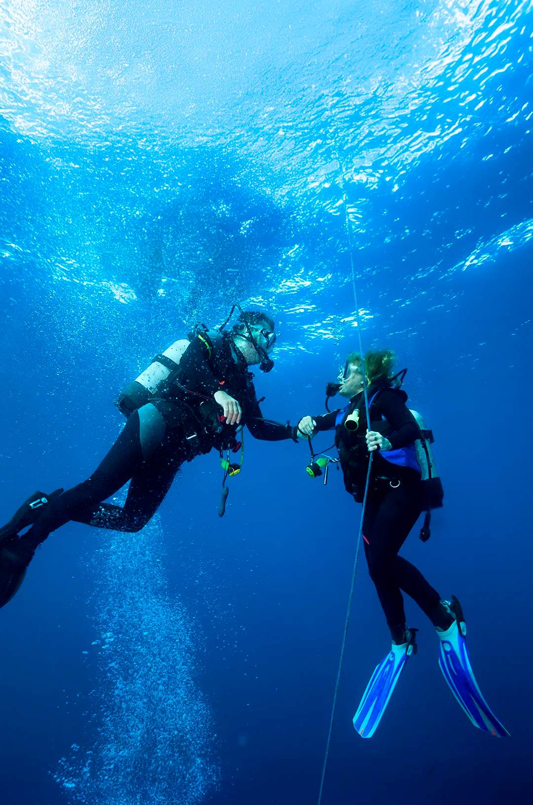Dive professional taking a student through a PADI ReActivate course in Puerto Vallarta.
