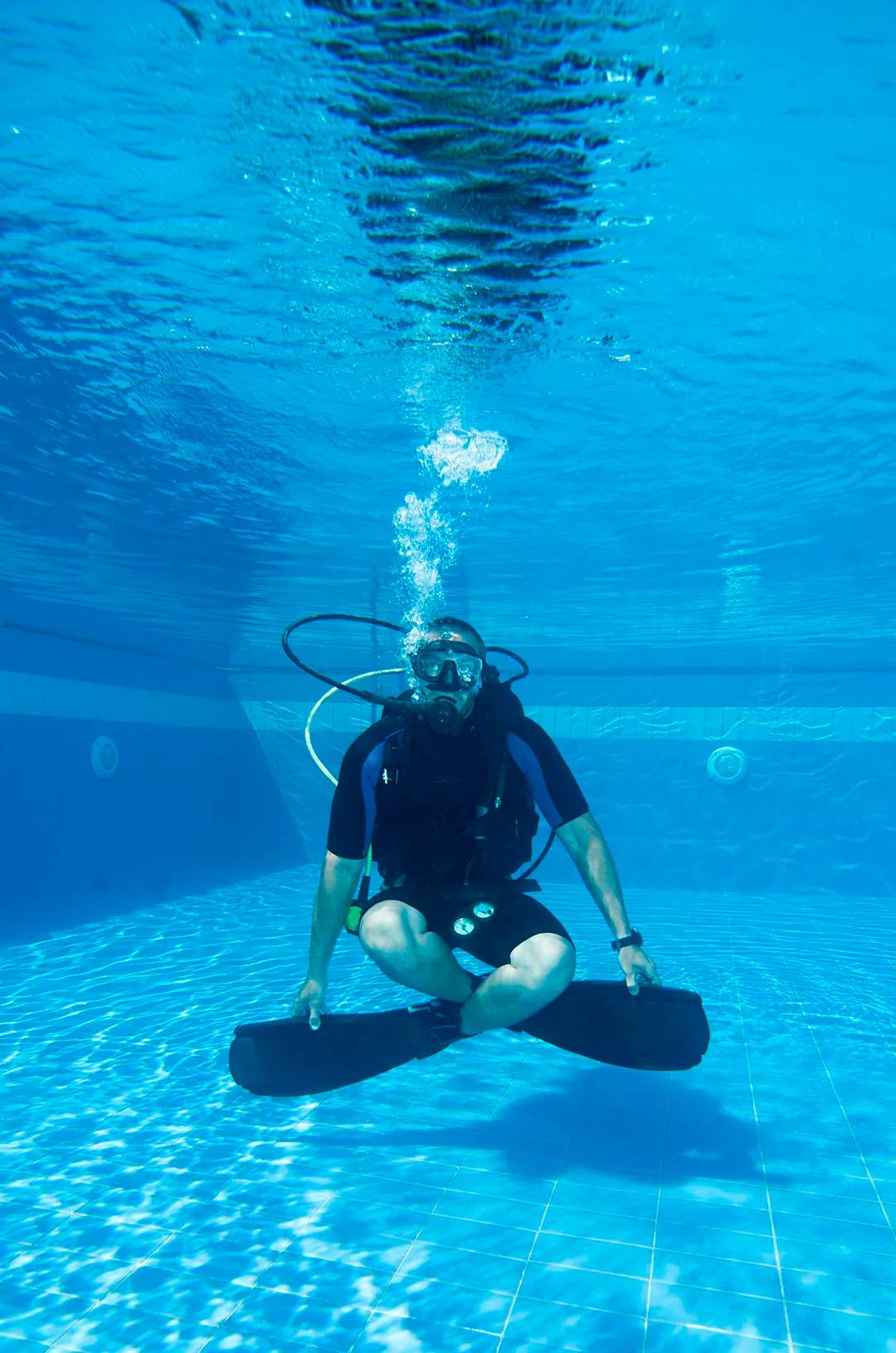 Underwater breathing practice in the safety of a pool in Puerto Vallarta.