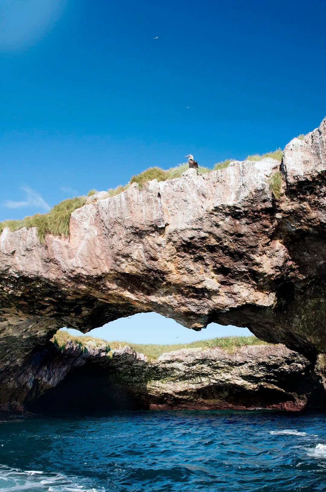 Rocky arch formations at Hidden Beach, Marietas Islands, one of the most stunning Mexico ecotourism destinations.