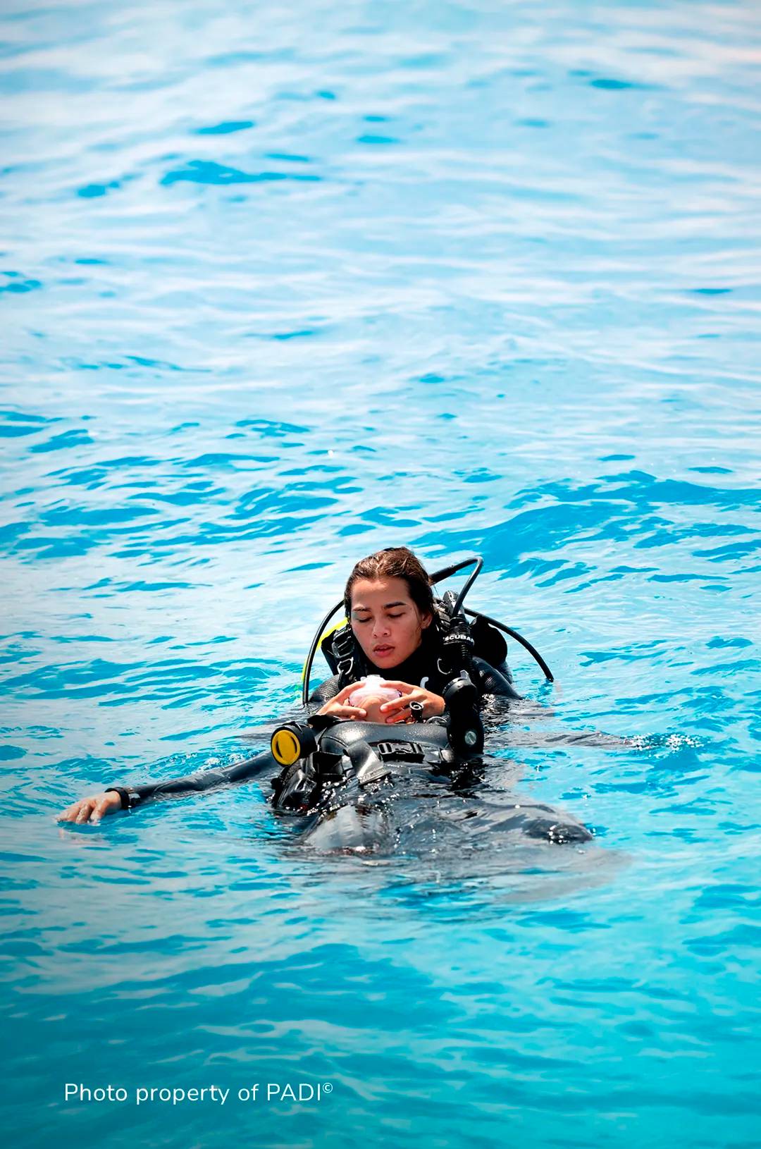 Scuba diver practicing a rescue in the ocean.