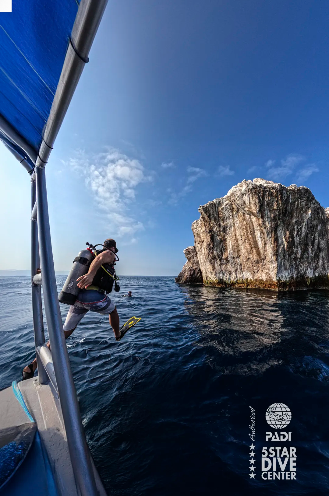 Certified Diver jumping into the water for a Scuba Diving tour at El Morro near Puerto Vallarta.