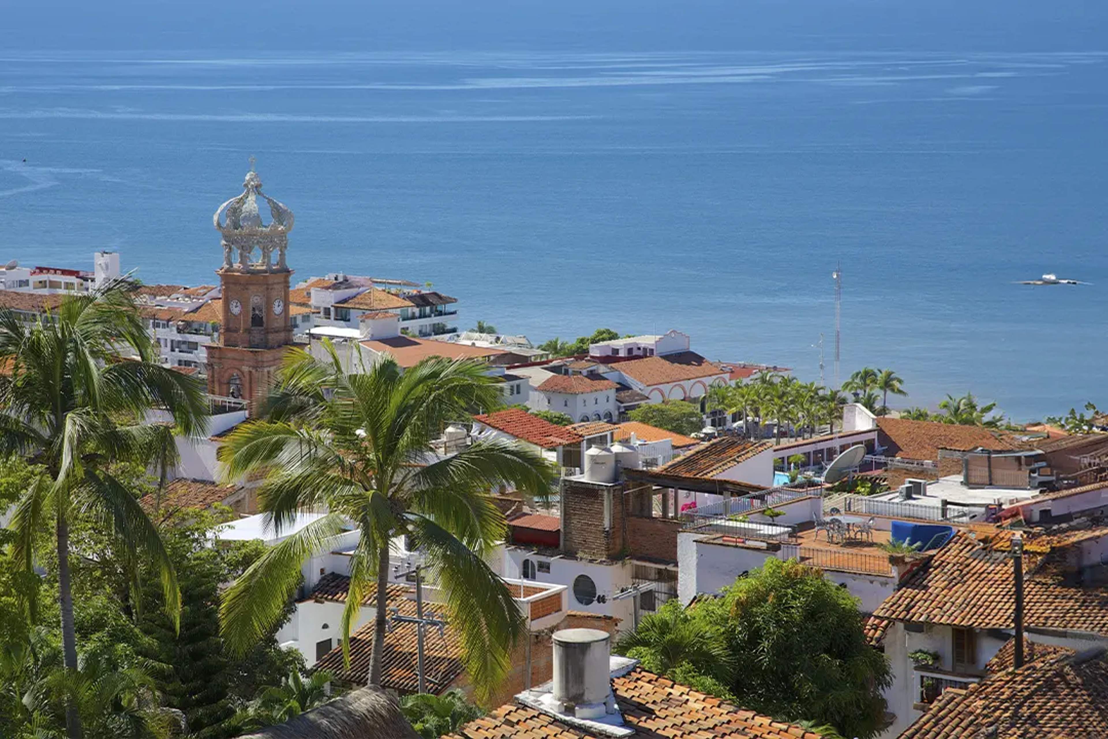 View of Puerto Vallarta with the Church of Our Lady of Guadalupe and the Pacific Ocean in the background.