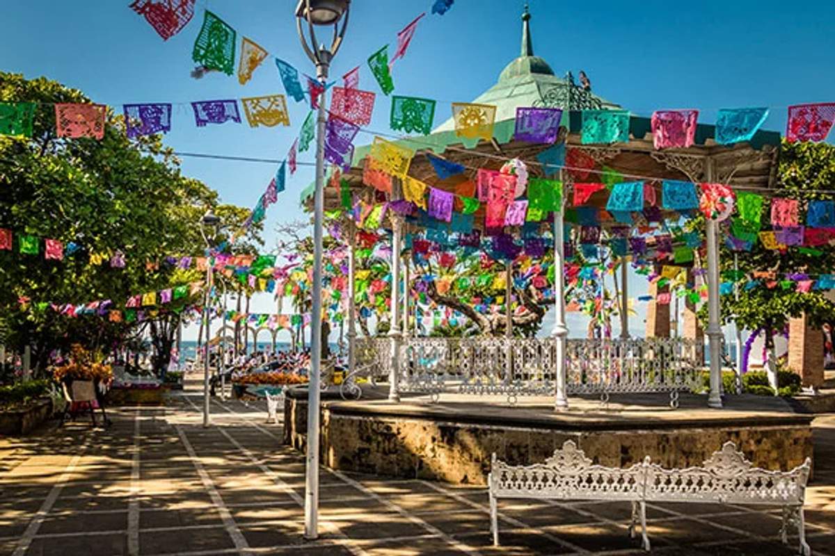 Colorful flags decorating the gazebo in Puerto Vallarta's Romantic Zone.