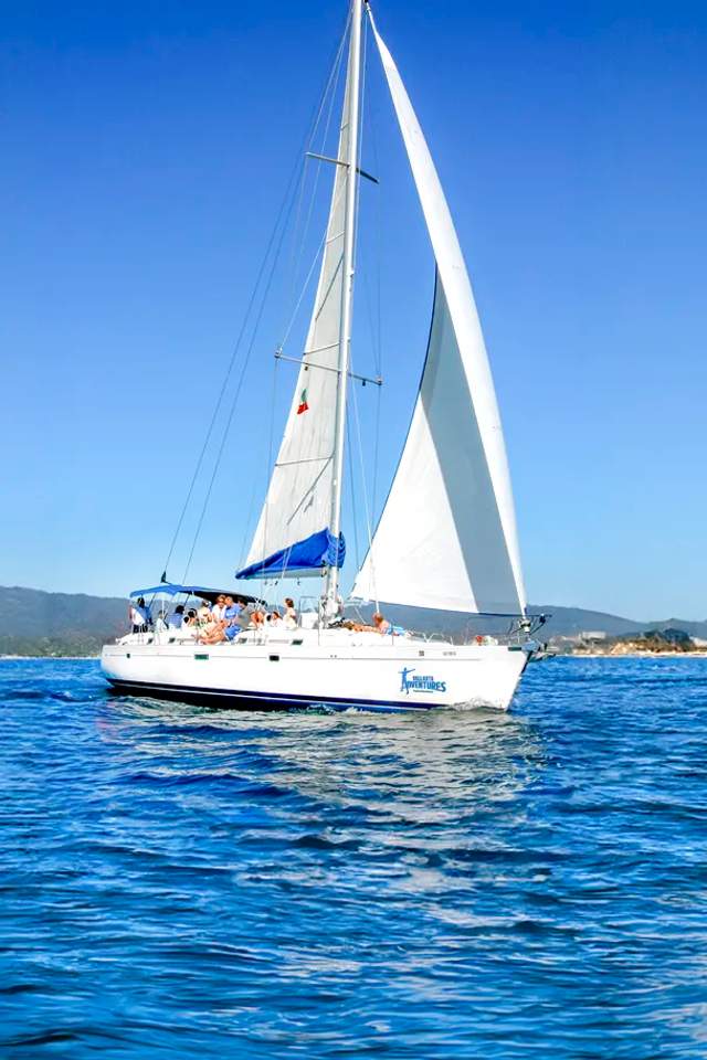 A sailboat on the clear blue waters of Puerto Vallarta.