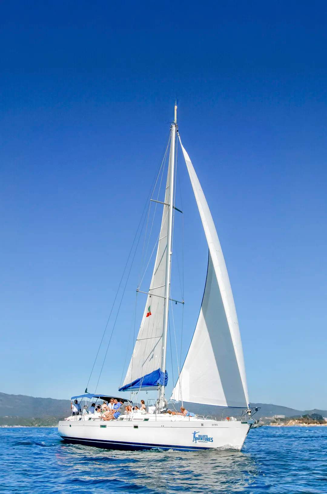 A sailboat on the clear blue waters of Puerto Vallarta.