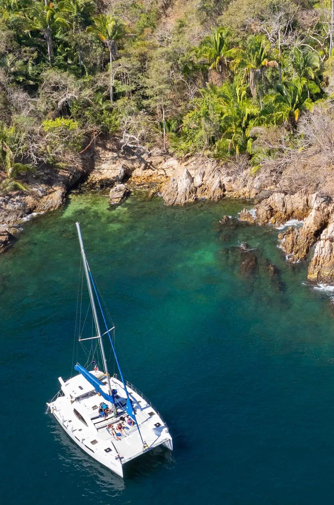 Sailing catamaran near Majahuitas during the best Puerto Vallarta snorkeling tour.