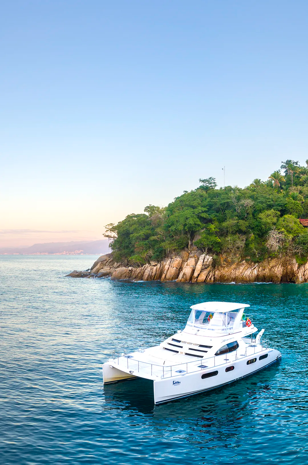 Luxury yacht anchored near Majahuitas beach, Puerto Vallarta, during an exclusive snorkeling tour by Vallarta Adventures.