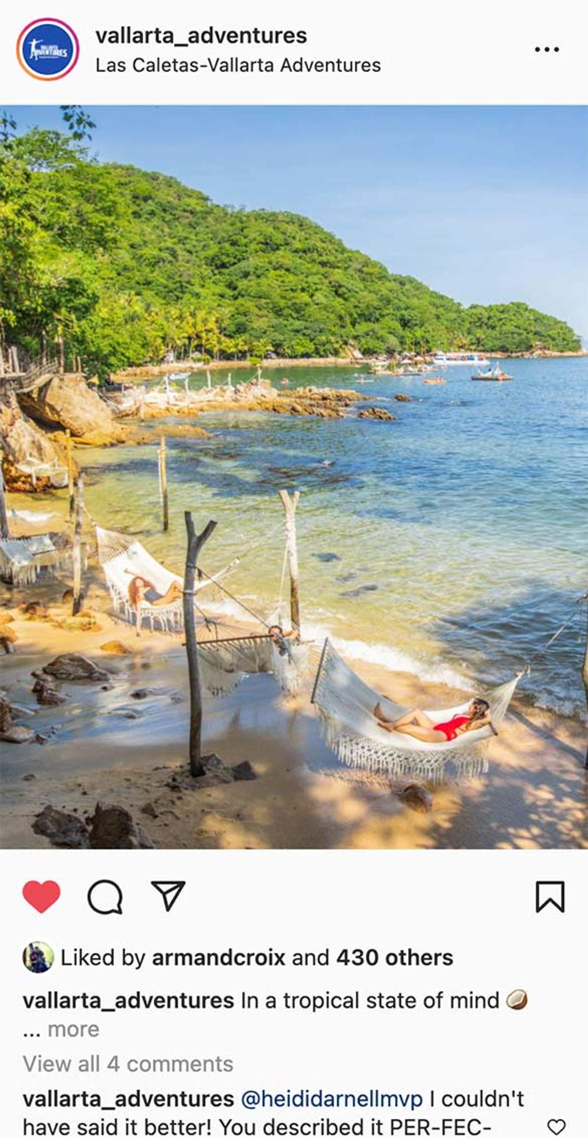 People relaxing in hammocks by the shore at Las Caletas, with boats and lush greenery in the background.