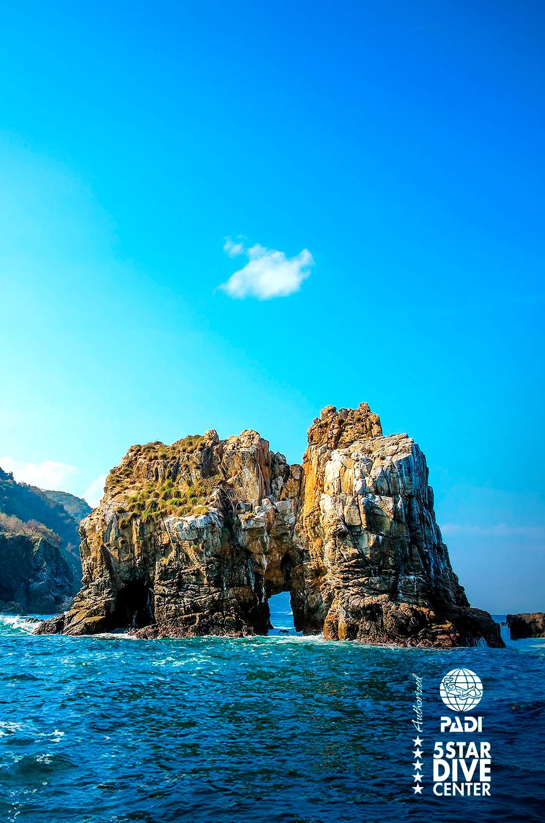 Las Iglesias rock formations rise from the ocean near Chimo, an advanced diving spot in Puerto Vallarta.