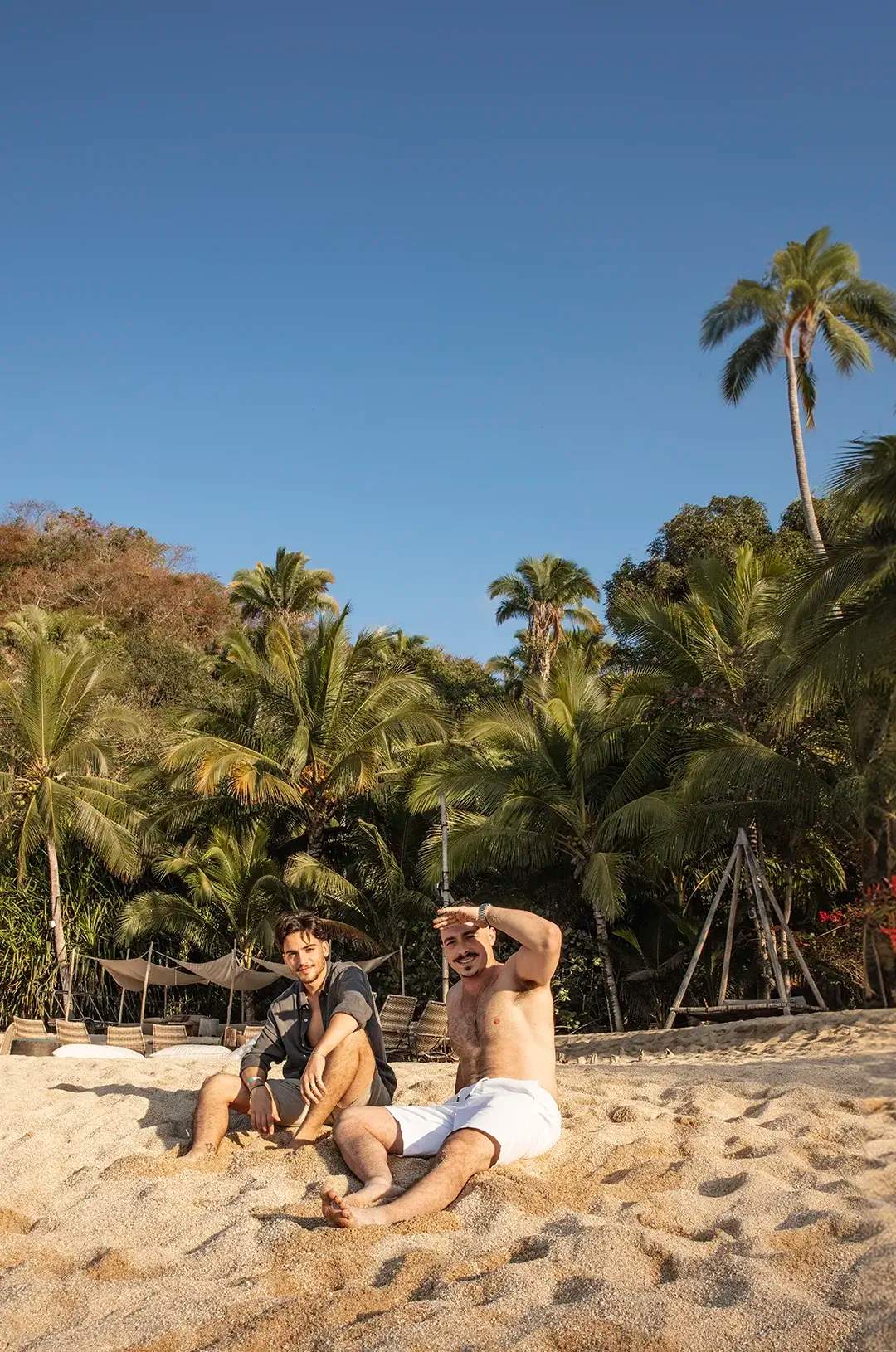 Friends sunbathing at Majahuitas after lunch.