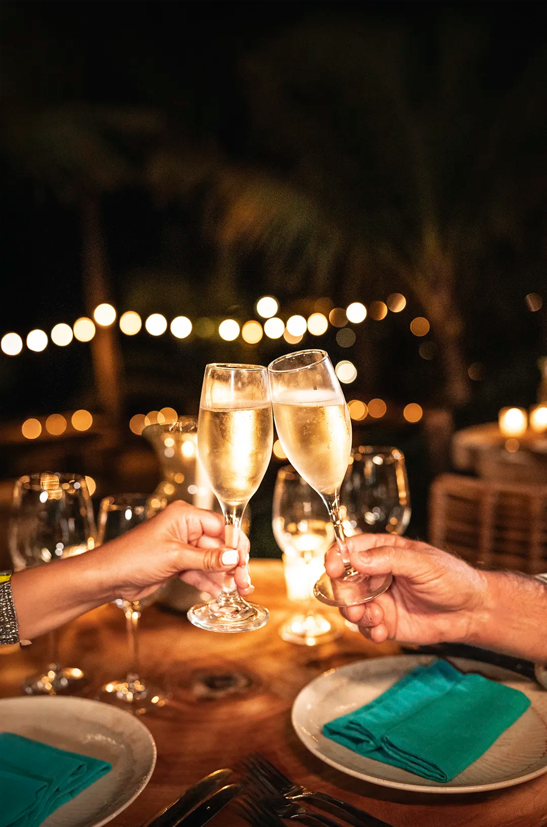 Champagne glasses in a toast.