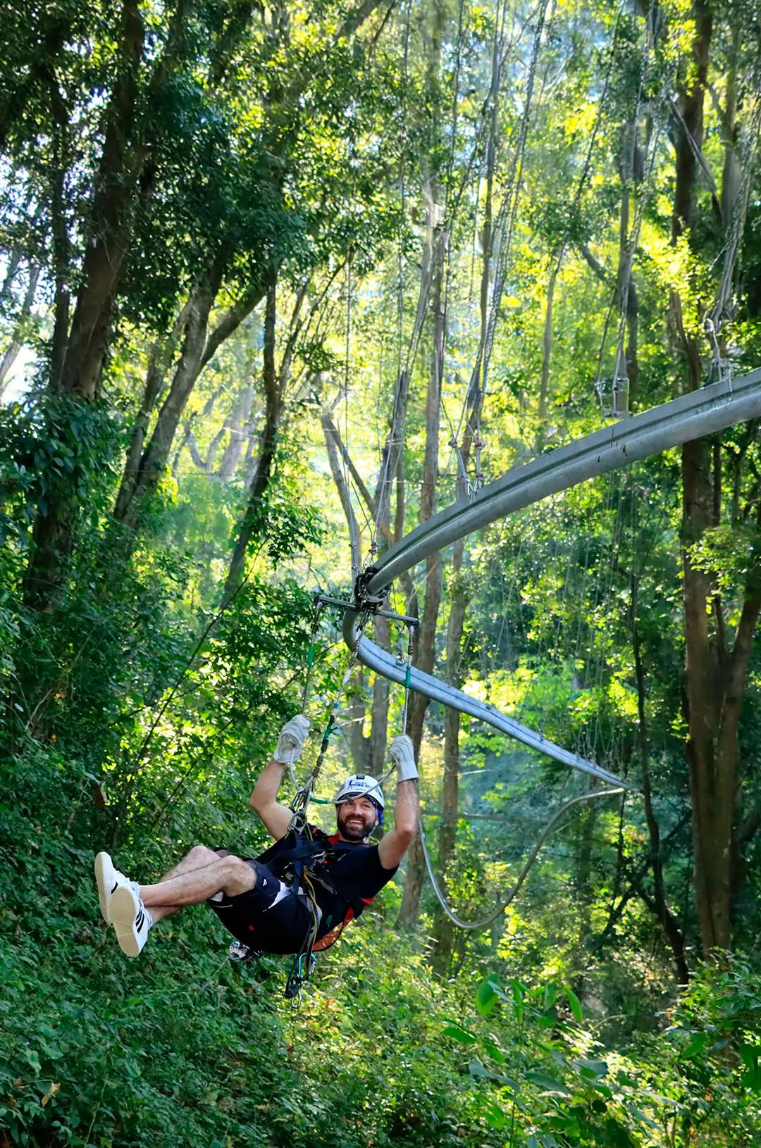 Man sliding on the only rollercoaster zipline in Puerto Vallarta.