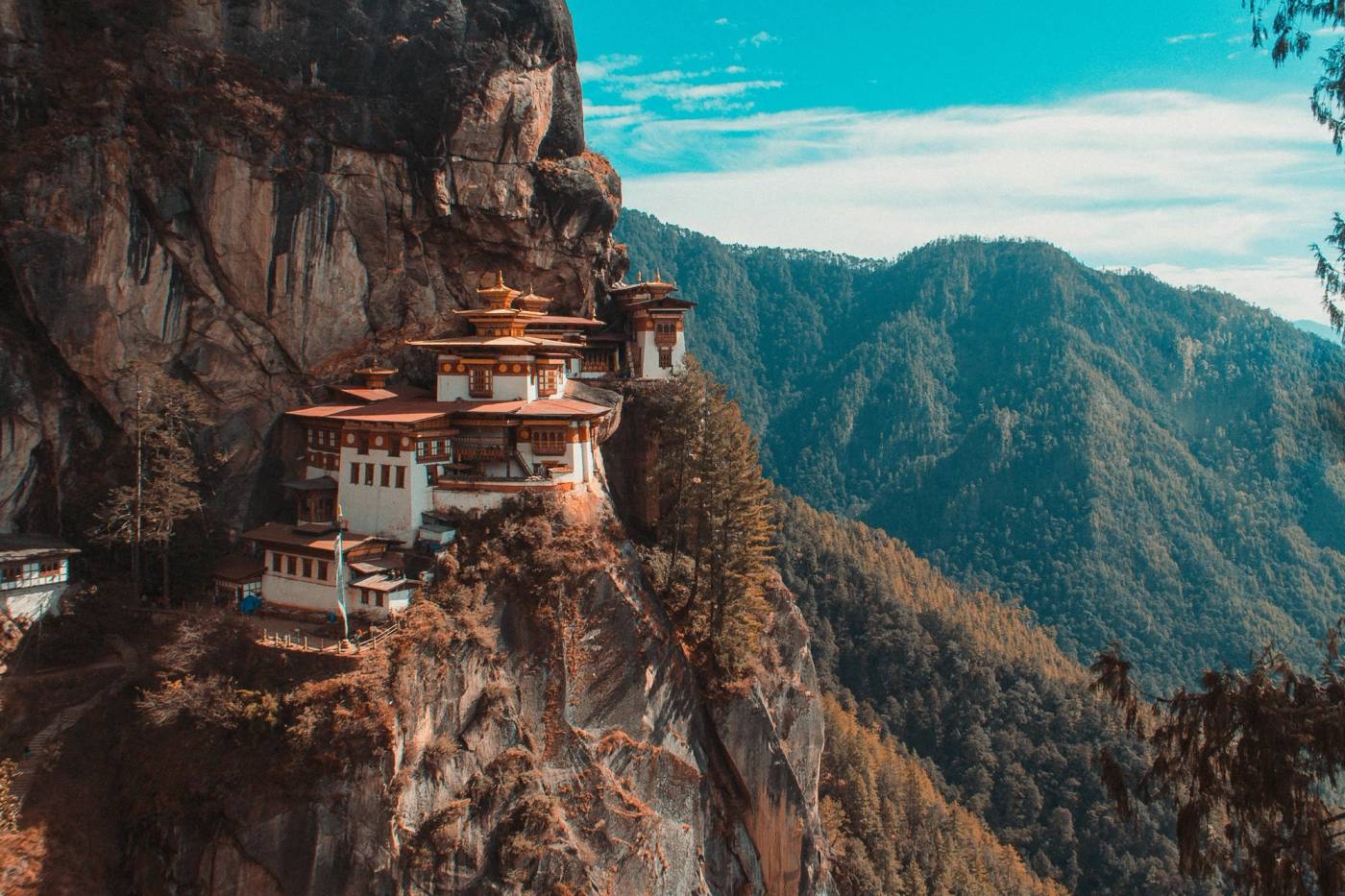 Tiger's Nest Monastery clinging to a sheer cliff above a forested valley