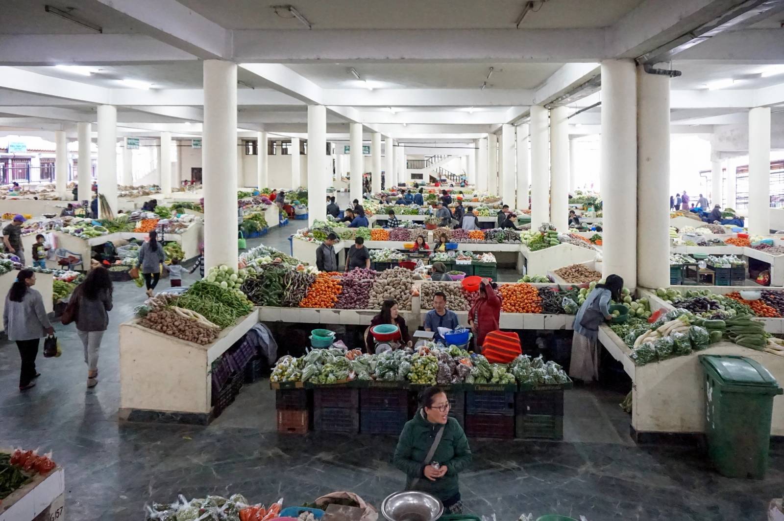 Vegetable stalls in the pillared hall of the Centenary Farmers' Market in Thimphu