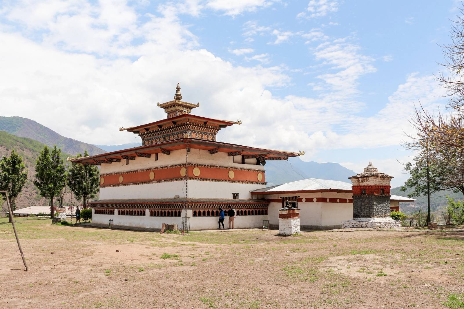 Chimi Lhakhang's small temple and chorten on a dry, open hilltop near Punakha