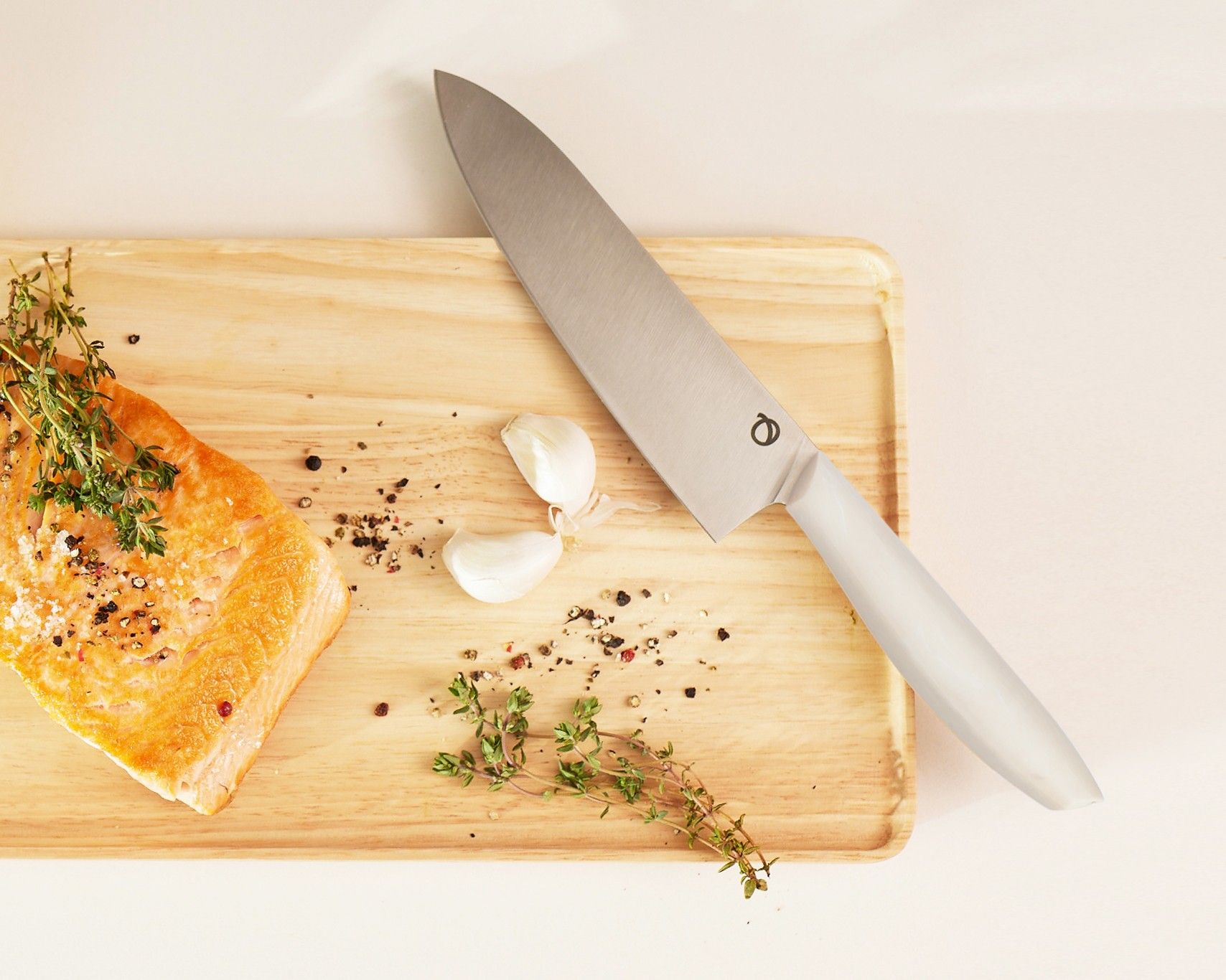 Olavson chef knife from above on cutting board