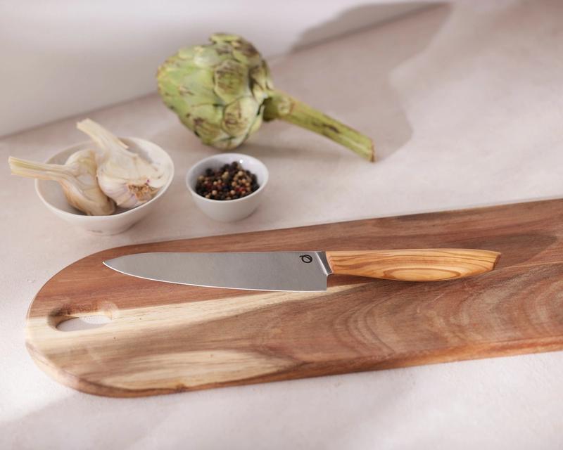 Olav chef knife from above on cutting board