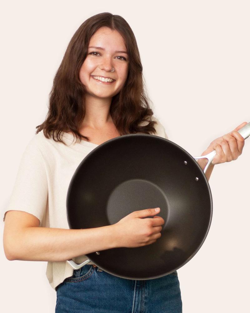 Olav employee Romina with wok