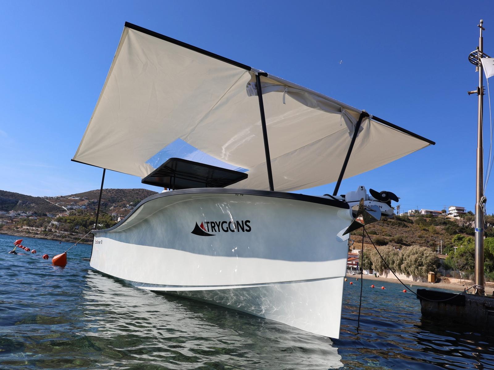 EcoRunner 78 moored with the optional sun awning extended over the T-top