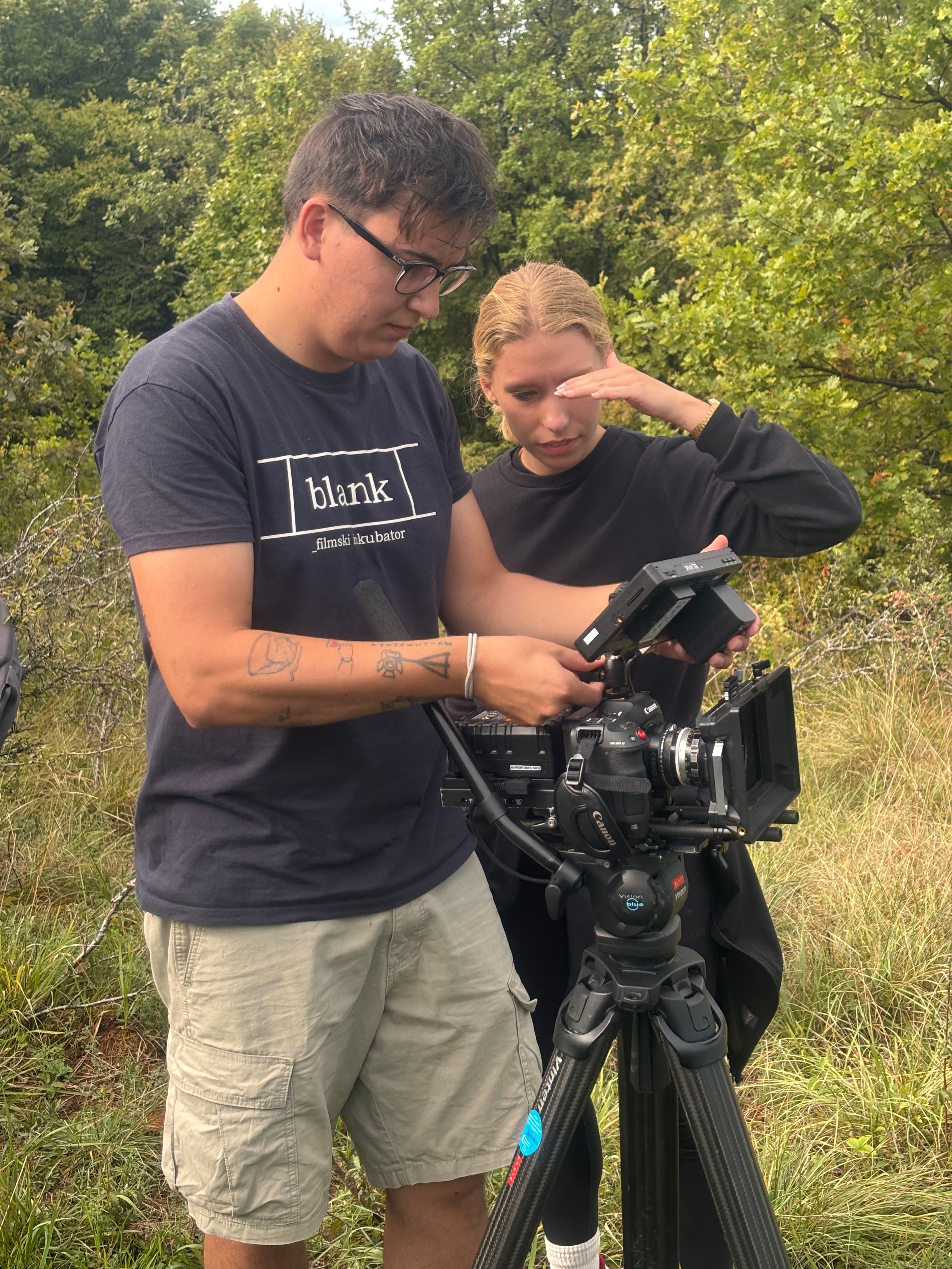 Setting up a shot by the stream
