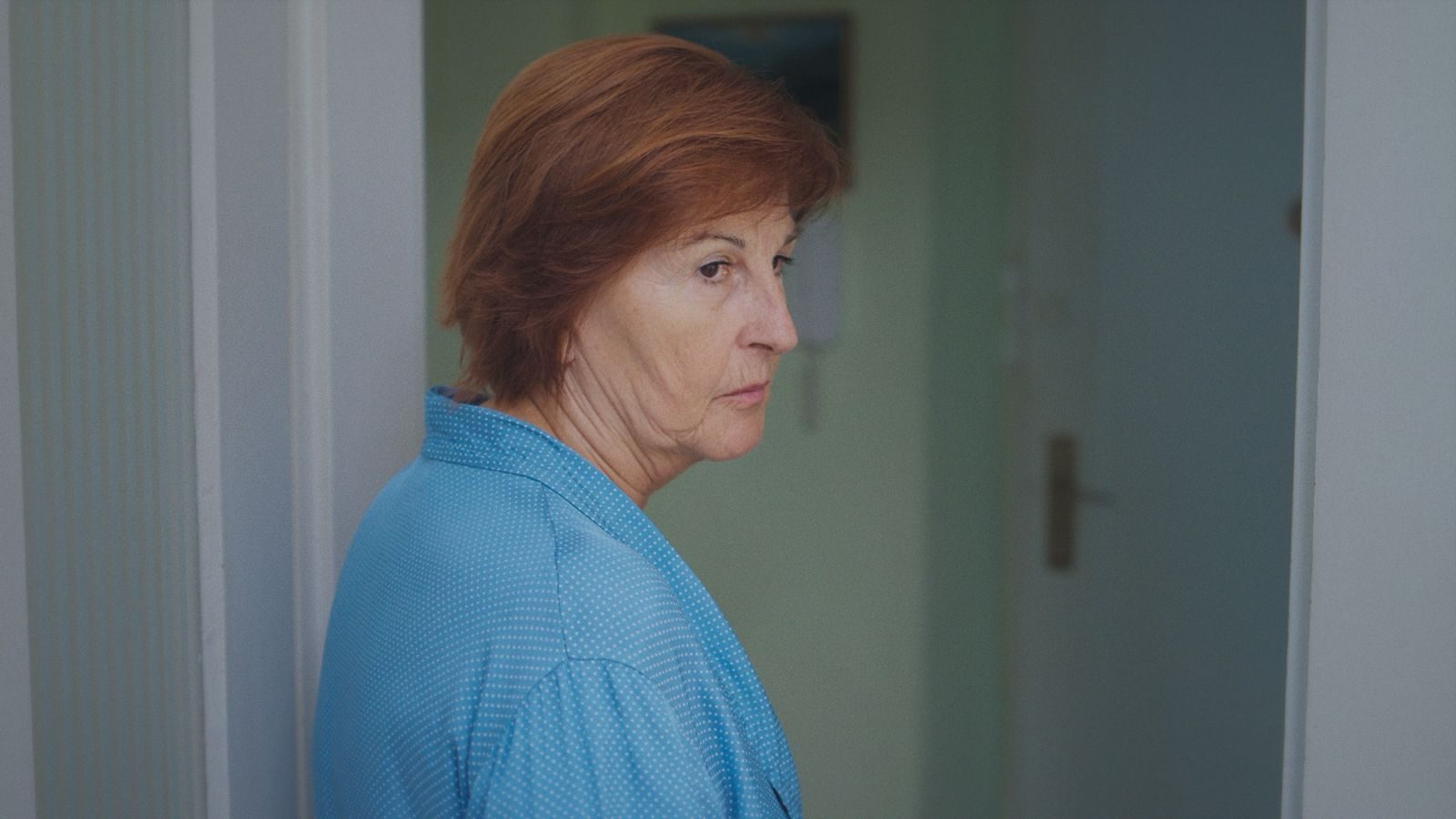 Zdenka in the doorway of the flat