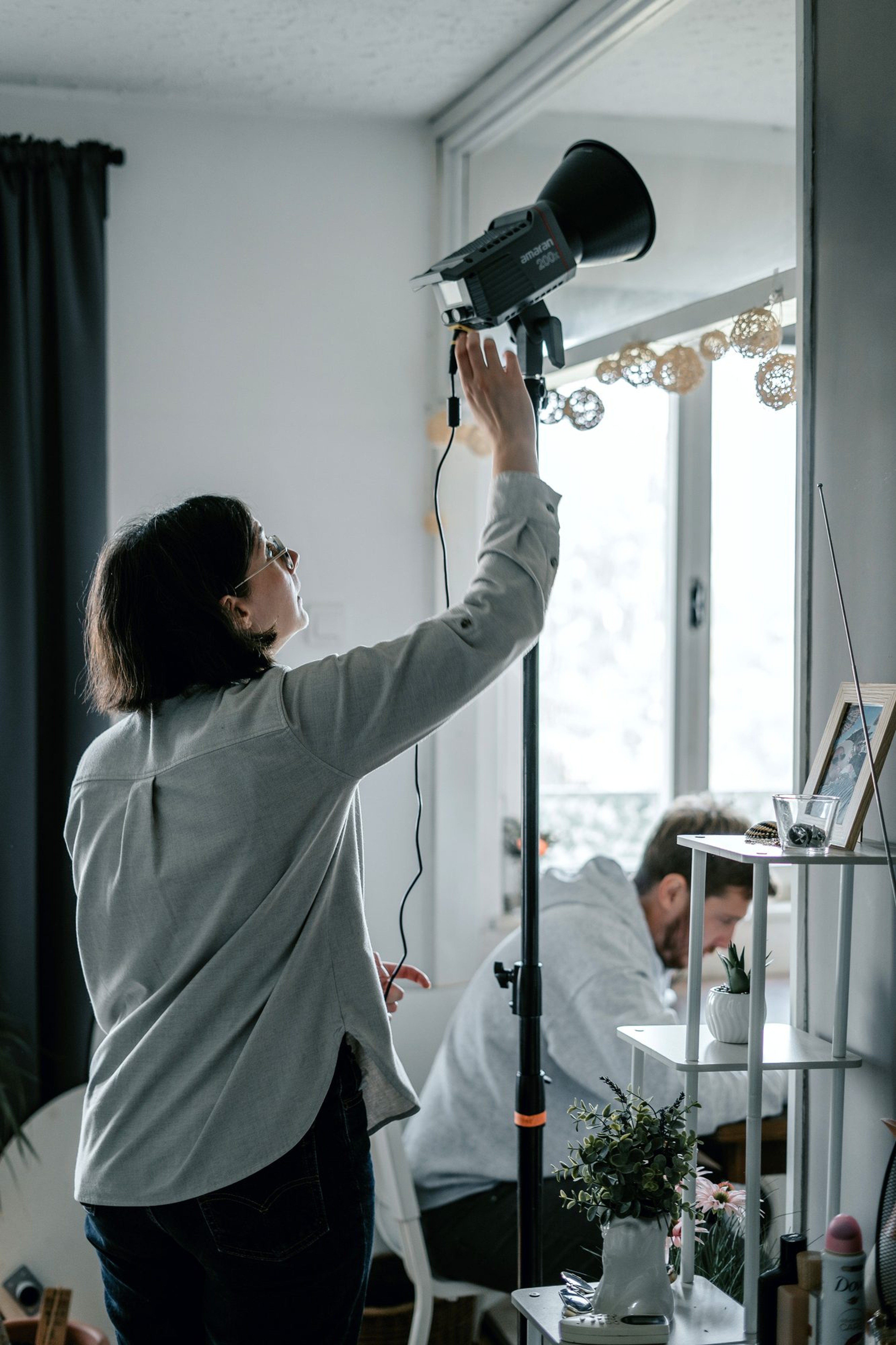 Setting up the lighting on set
