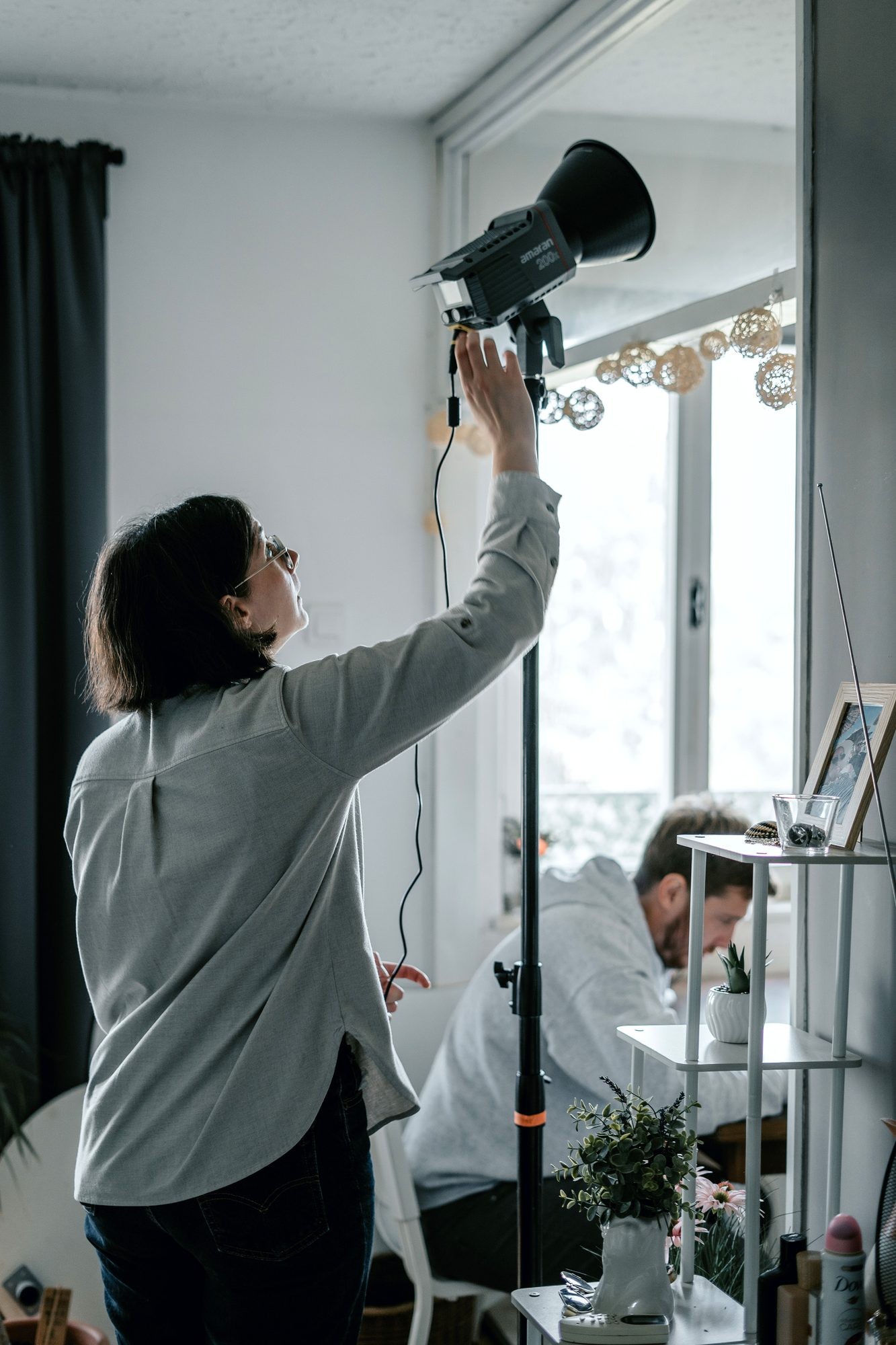 Setting up the lighting on set
