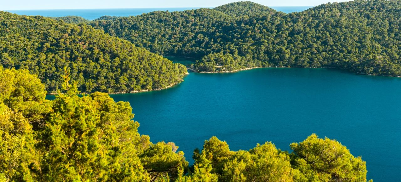 Panorama of Island Mljet from the rocks high up on sunny day.
