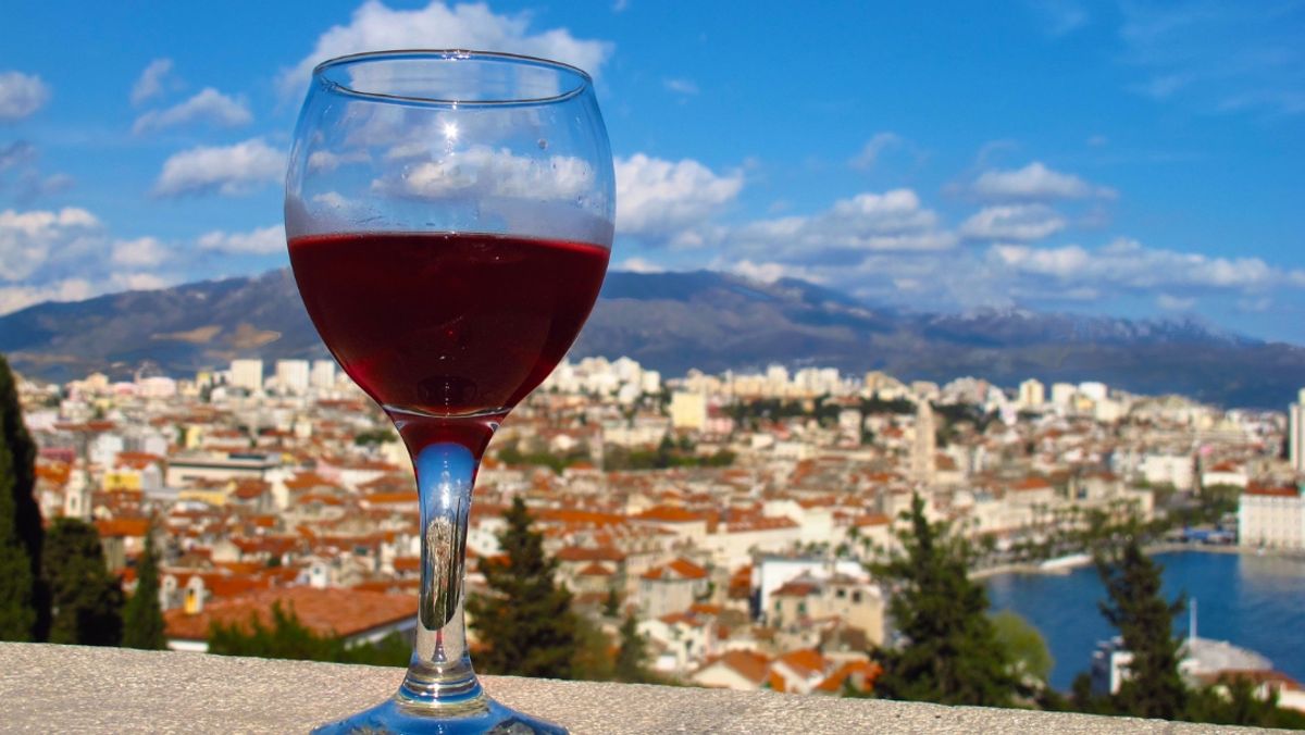 glass of wine on wall Marjan Hill overlooking Split, Croatia