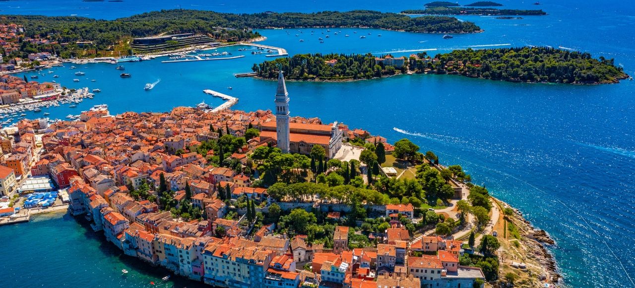 Aerial panoramic view of romantic and historic Town of Rovinj on sunny summer day, Istra, Croatia