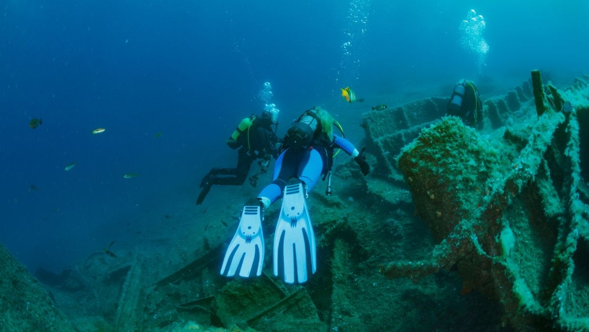 Scuba divers explorting the underwater realm of Croatia