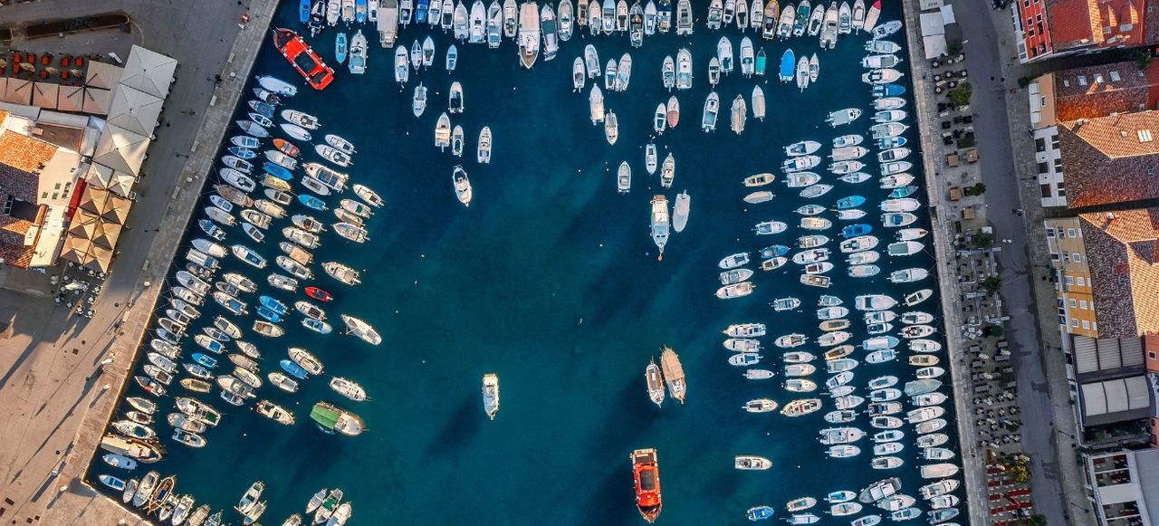 Aerial view to Rovinj marina with many boats. Istria, Croatia.