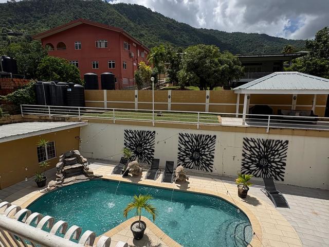 Swimming pool and outdoor seating area at Maracas Valley Villa in St. Joseph, Trinidad.