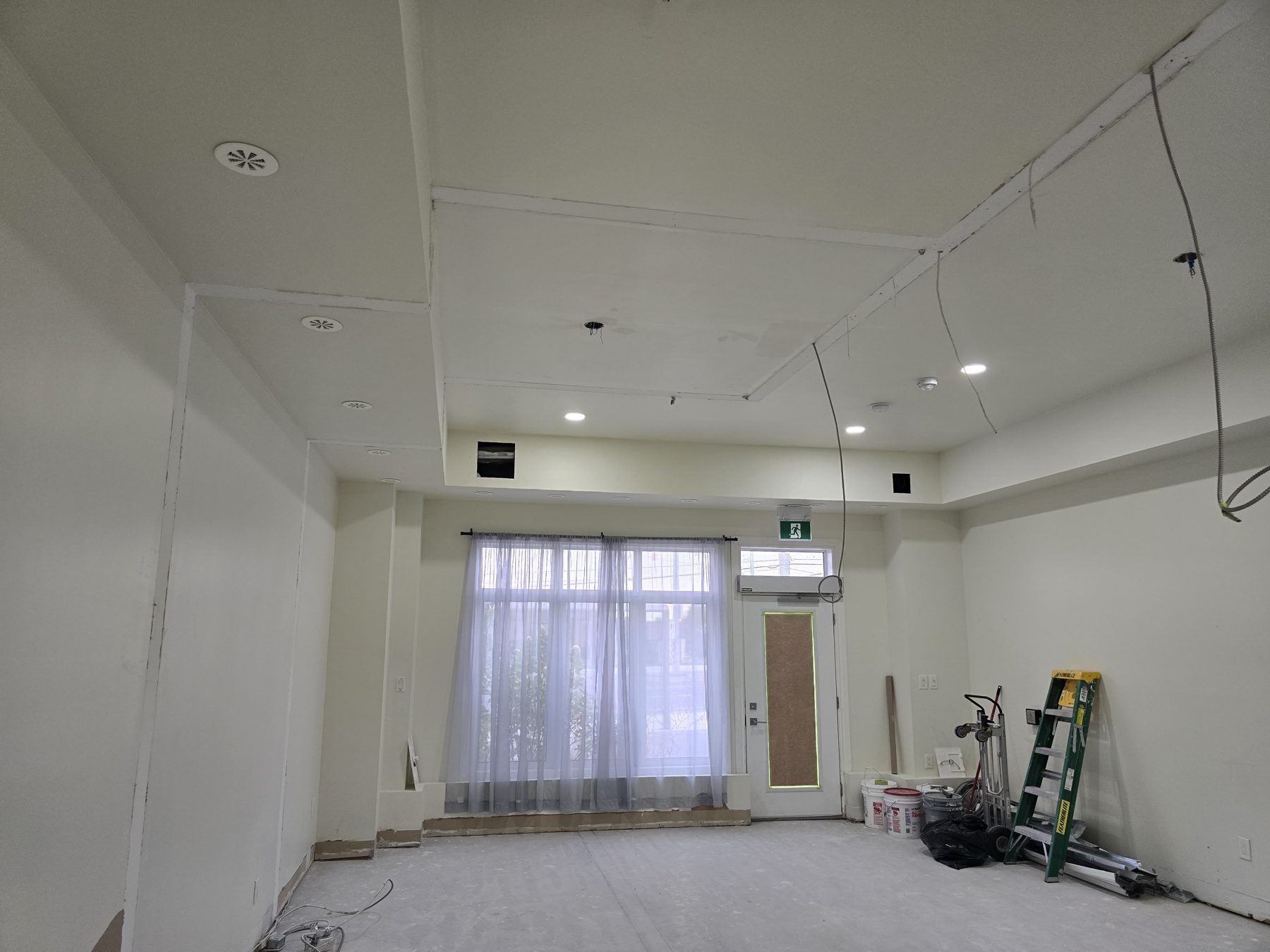 Treatment area shell with exposed drywall