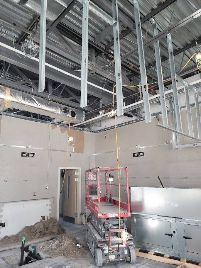 Open shell with scissor lift during mechanical installation