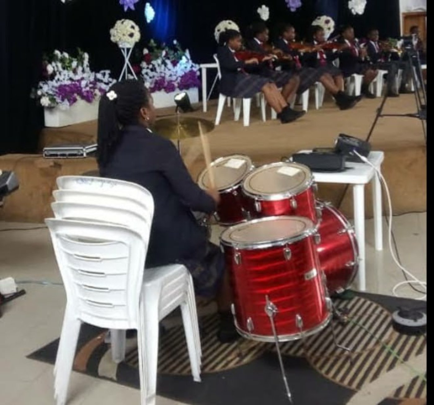 Drumming at a secondary school concert