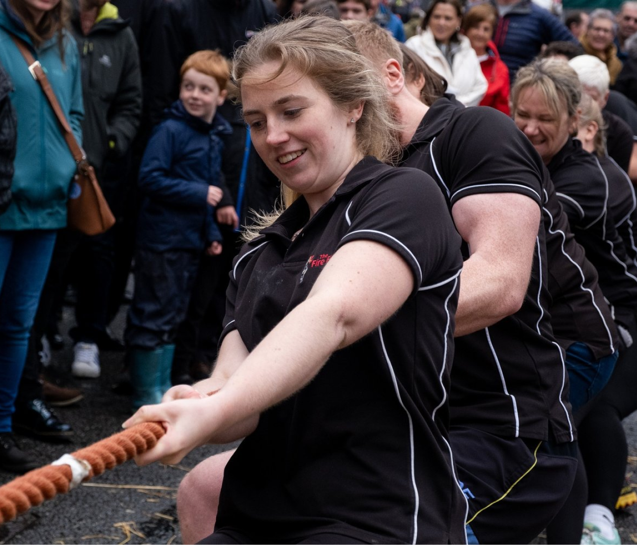 People playing tug of war.