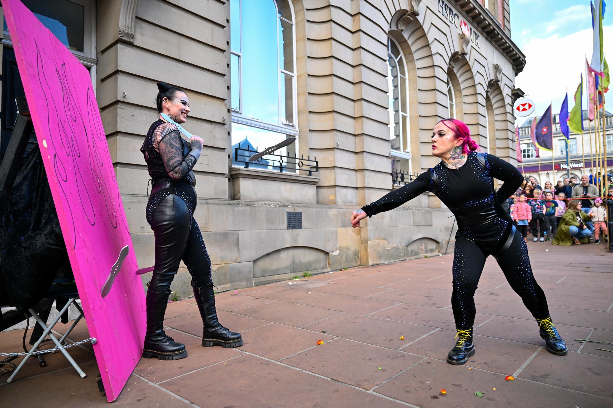 A street performer throwing a knife