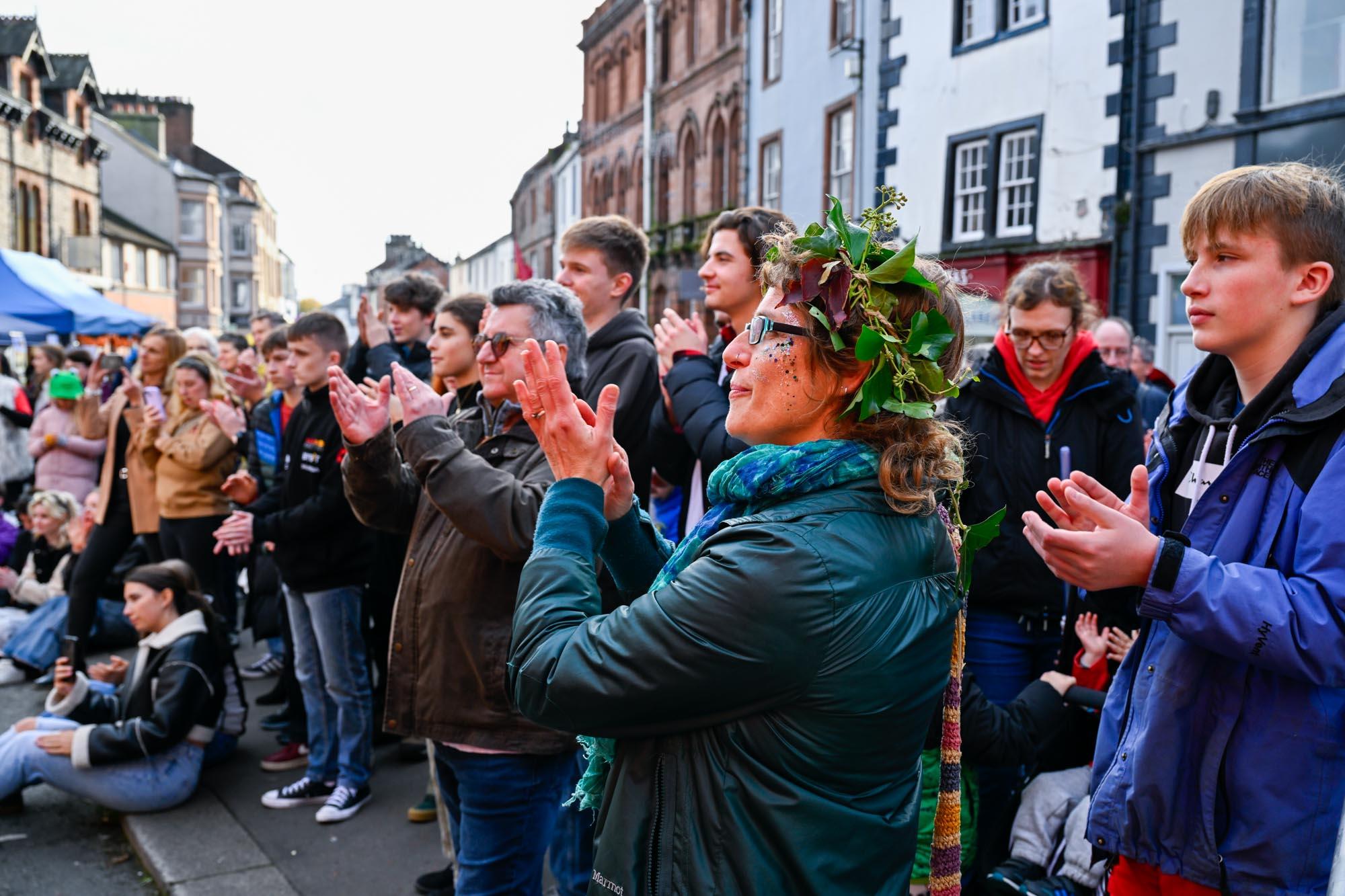 Audience members applauding