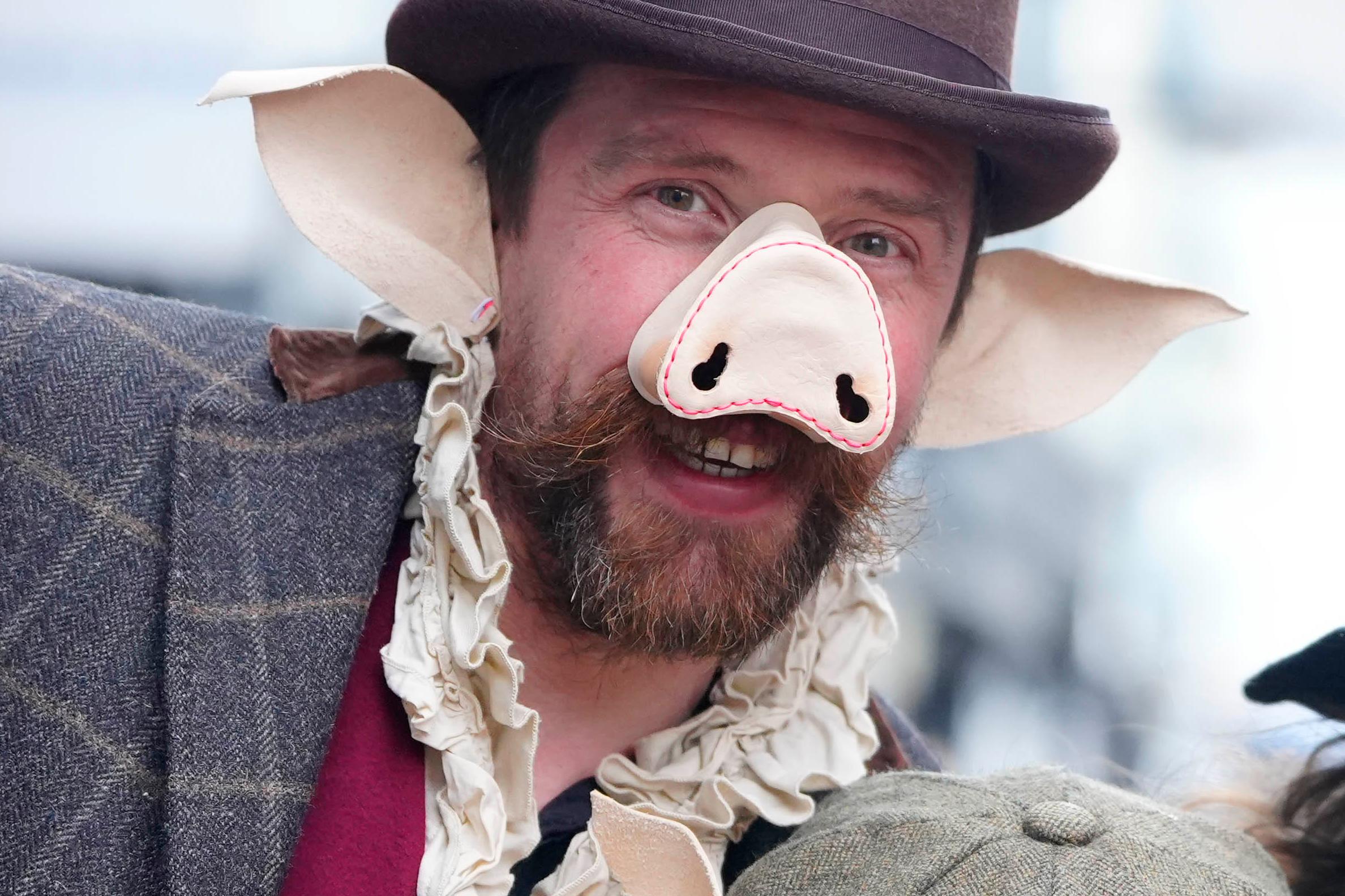 Winter droving participant wearing pig mask and ears
