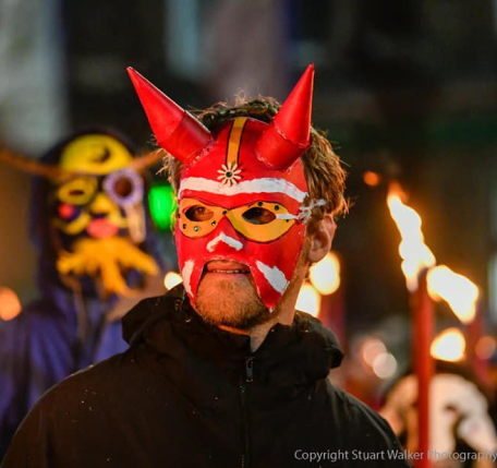 A person using a red mask at the winter droving