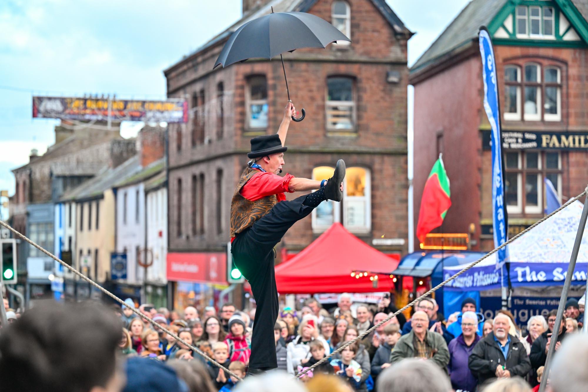 A street performer walking a tightrope