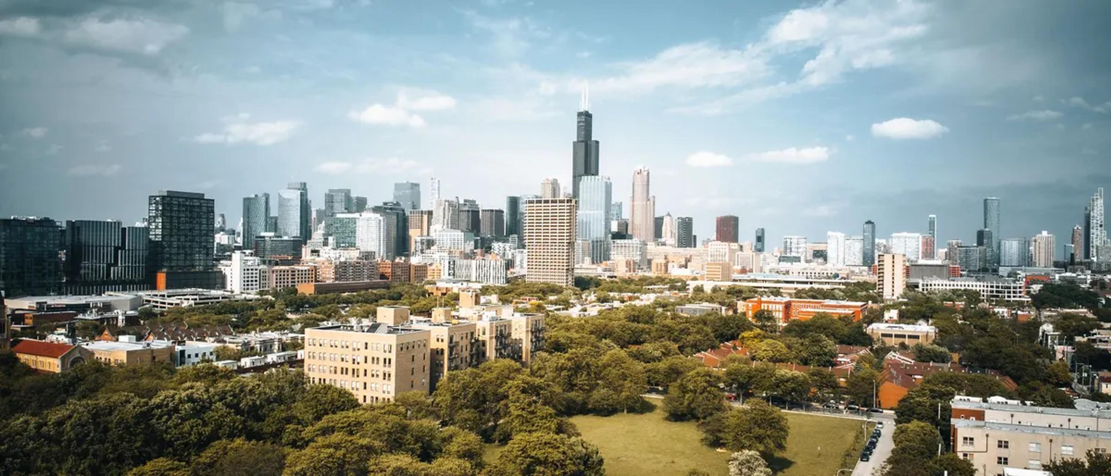 The Chicago skyline rising above the leafy North Side neighborhood near Boystown