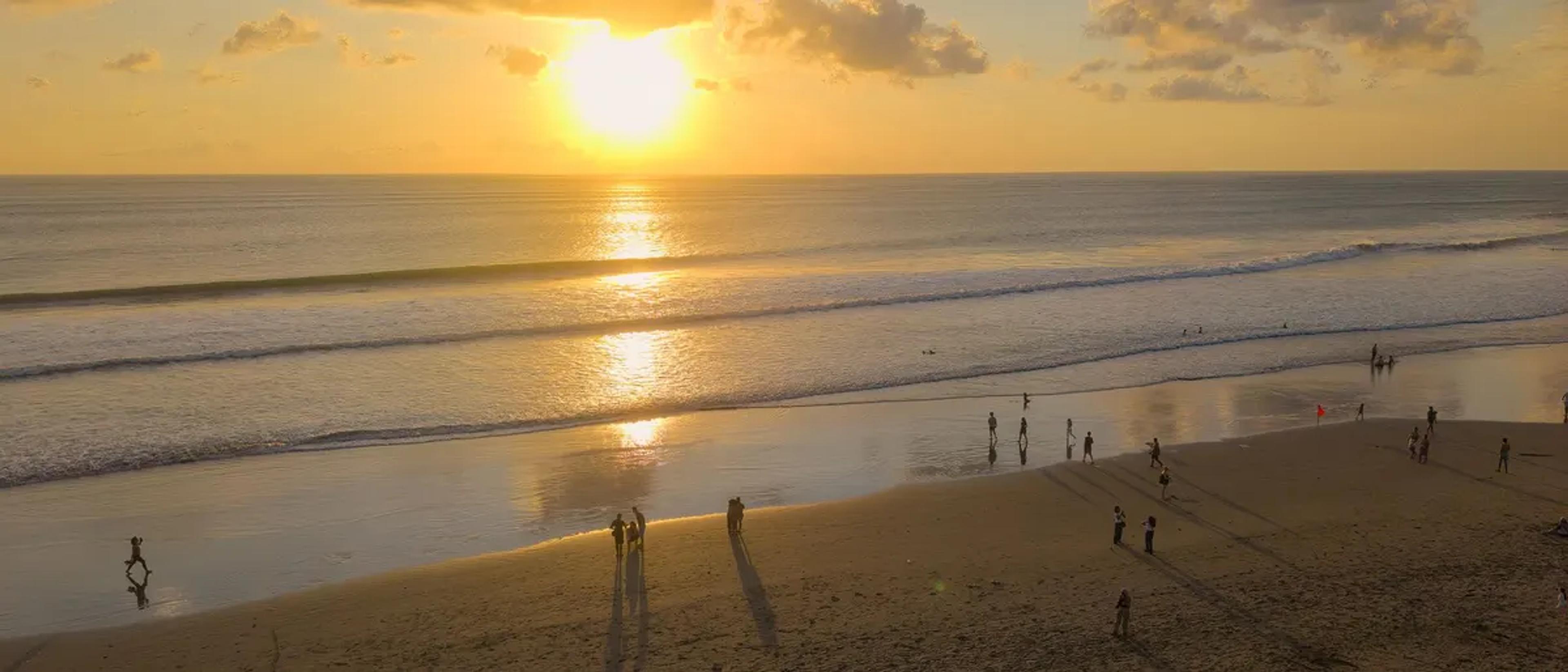 Sunset over Seminyak Beach in Bali, Indonesia
