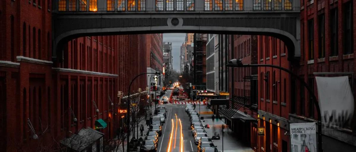 The High Line footbridge arching over a Chelsea street in Manhattan at golden hour