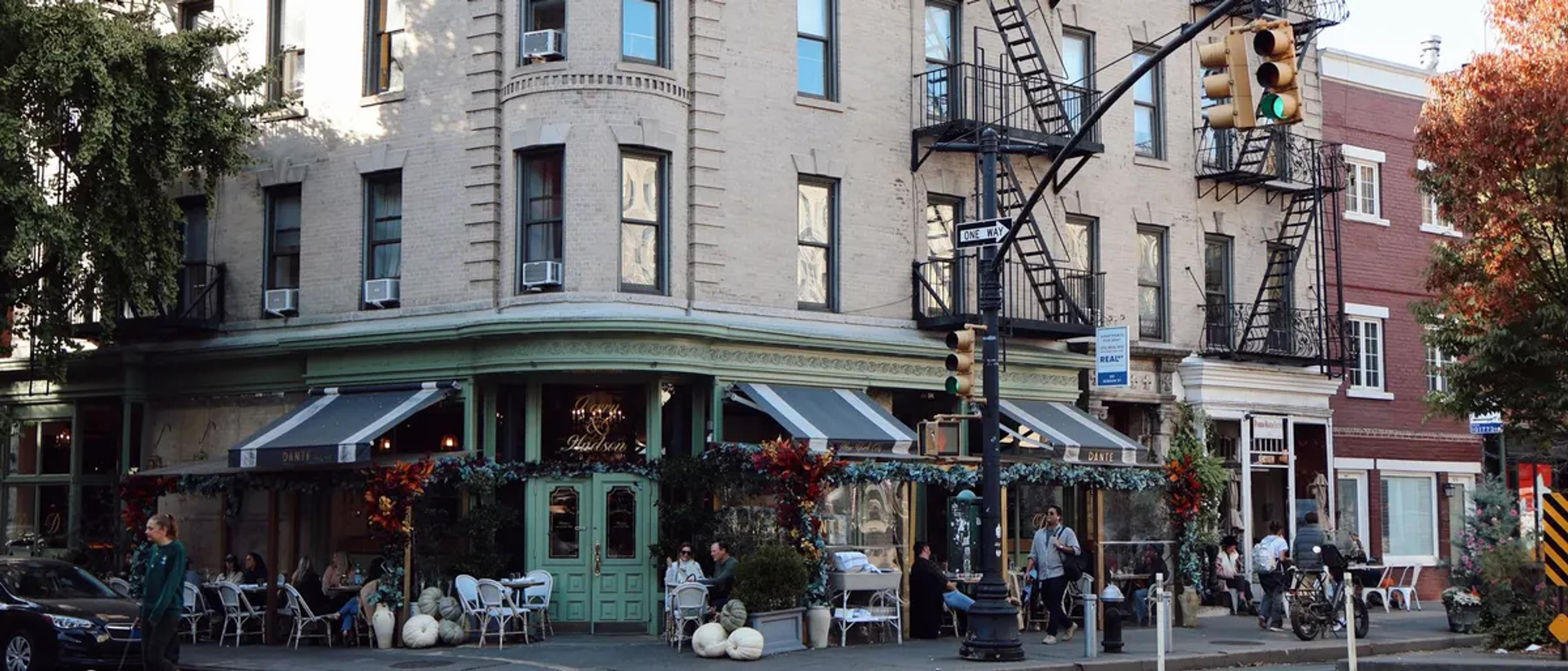 A classic corner cafe on a tree-lined street in New York's West Village in autumn