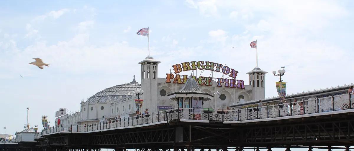 Brighton Palace Pier on the seafront under a blue sky